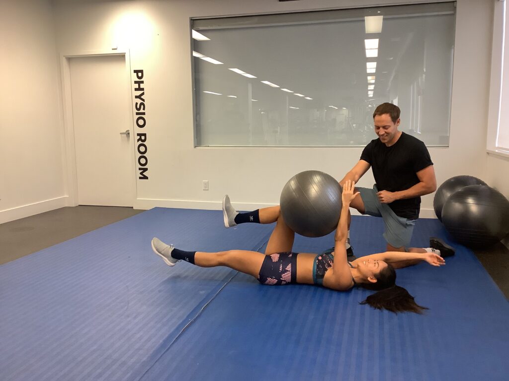 Personal trainer coaching a client through a strength exercise in Vancouver